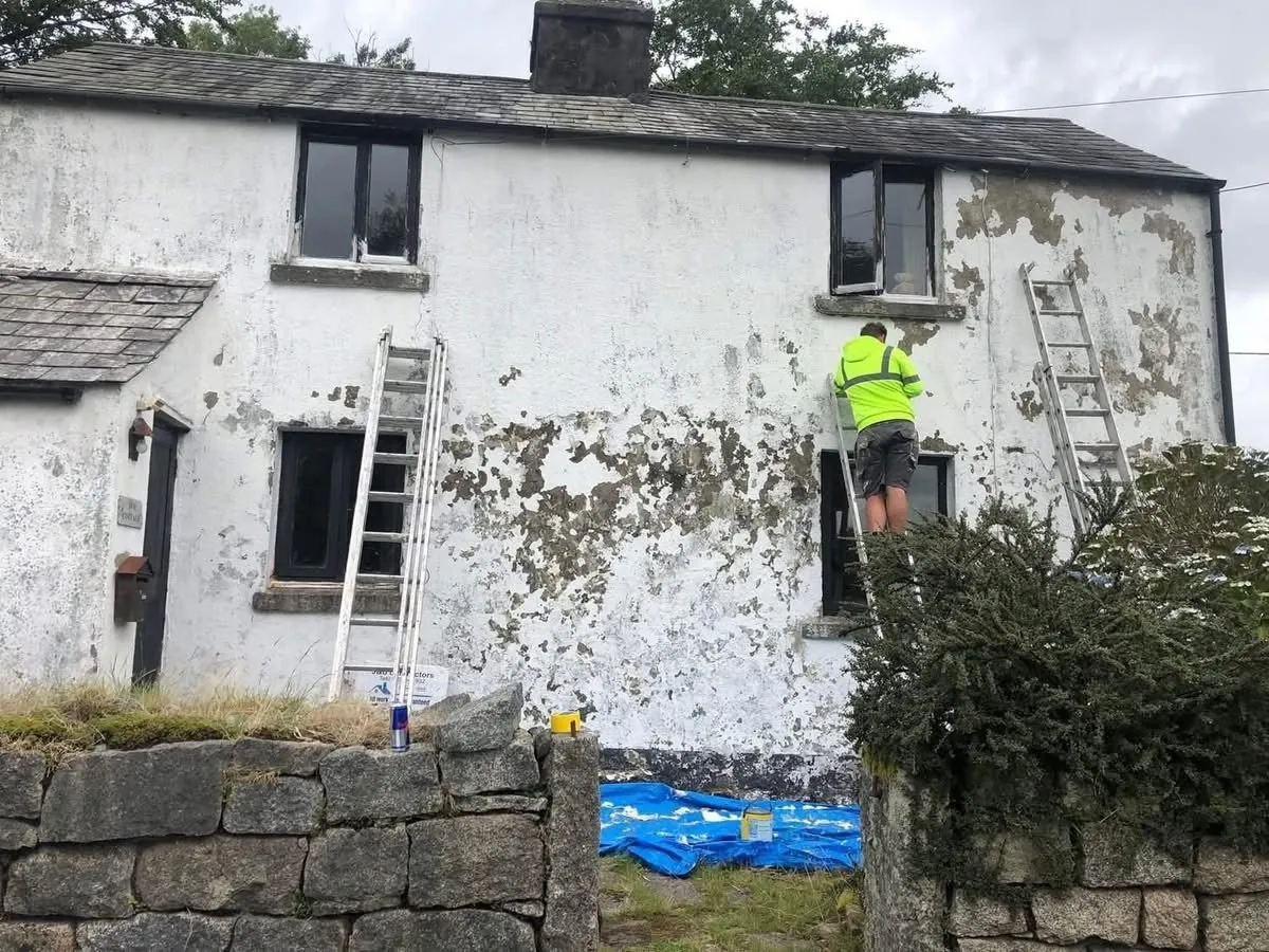 Cottage with blown, flaking render before repair in Launceston